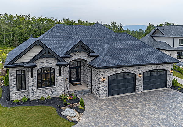 Luxury home roof aerial view of house after cleaning black algae streaks